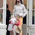 Harper Beckham lovely braided hair tied, holding the doll went shopping with her mother