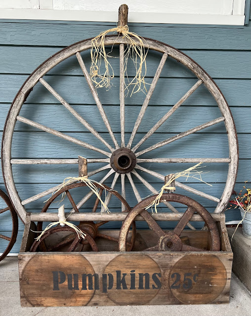 Photo of junky wheels repurposed as fall pumpkins.