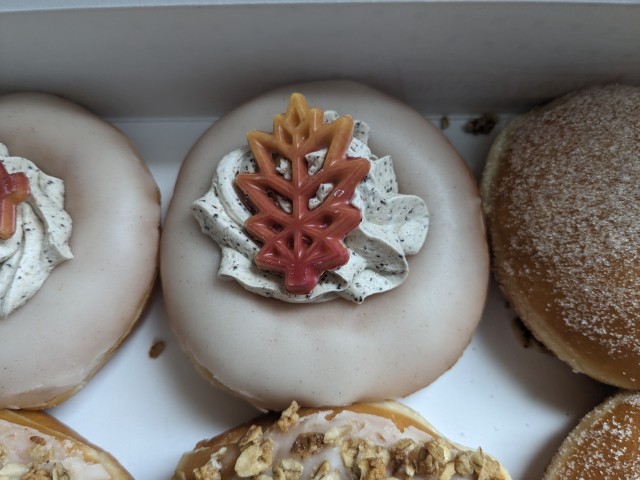 Close-up of Krispy Kreme Cinnamon Latte Donut.