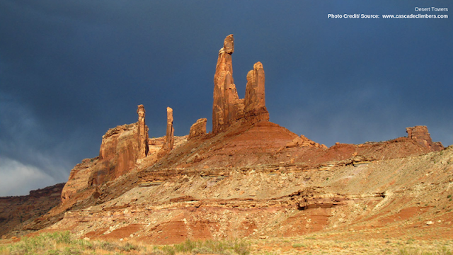 clouds looming behind the Desert Towers