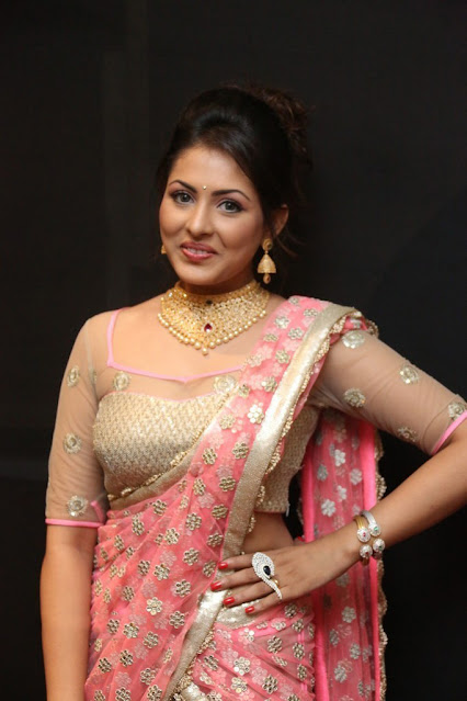 Madhu Shalini looking radiant in a pink saree, showcasing timeless beauty and grace.