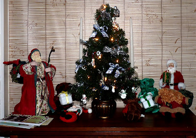 display with toys, Santas, and little tree