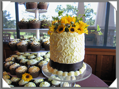 A beautiful wedding cake topped with radiant sunflowers from Celebrations