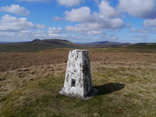 The trig point on Horse Head looking towards Penyghent and Ingleborough