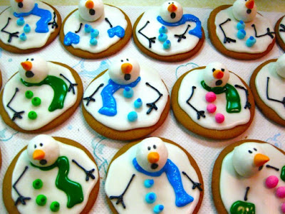 Cookies decorated with icing and marshmallow for head to make snowmen