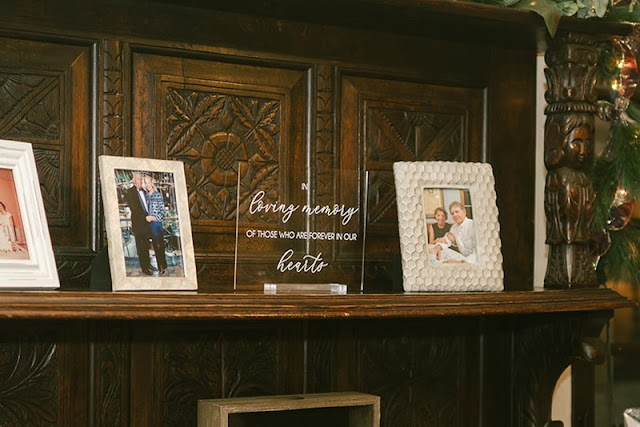 acrylic memorial sign on hutch with picture frames