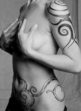 side tattoos for women. Lower back tribal tattoos for