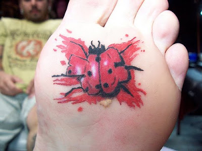 Ladybug tattoo on bottom of foot