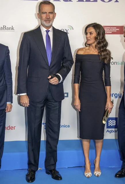 Queen Letizia wore a black dress. Pdpaola diamond pearls earrings, Aquazzura slingback pumps, Magrit clutch