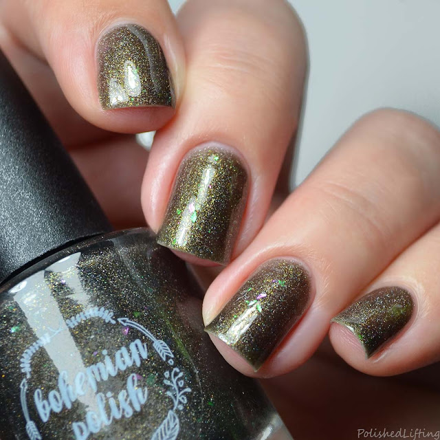 black nail polish with gold shimmer