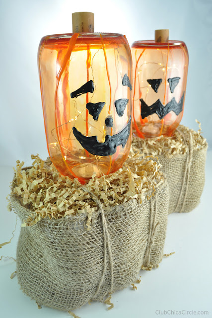 http://club.chicacircle.com/glass-pumpkin-jack-o-lanterns-on-homemade-hay-bales/