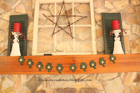 Eclectic Red Barn: Shamrock banner on fireplace mantel
