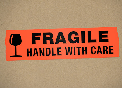 A box labeled "Fragile, Handle with Care"