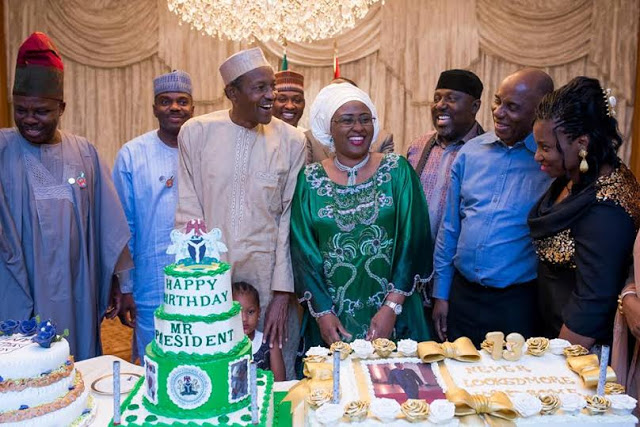 President Buhari with wife and staff 