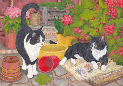 A jigsaw puzzle of cats relaxing next to flowers / Palapeli kissoista, jotka lepäilevät kukkien vieressä