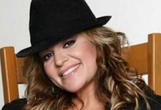 Jenni Rivera in black cap