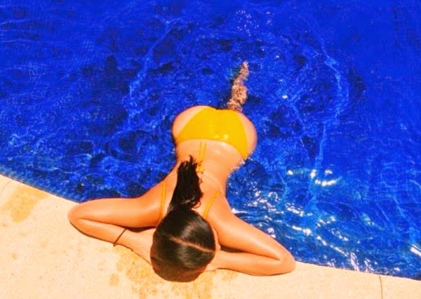 [Photos] Topless Kim K Shows off her perfect Bum while Sunbathing in Mexico