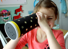 Tessa and I created a constellation viewer with an empty Pringles can, card stock and star stickers.