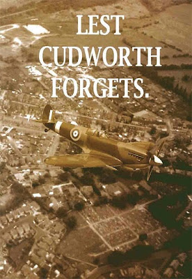 A sepia book cover, showing a Spitfire flying over Cudworth.  The caption is Lest Cudworth Forgets.