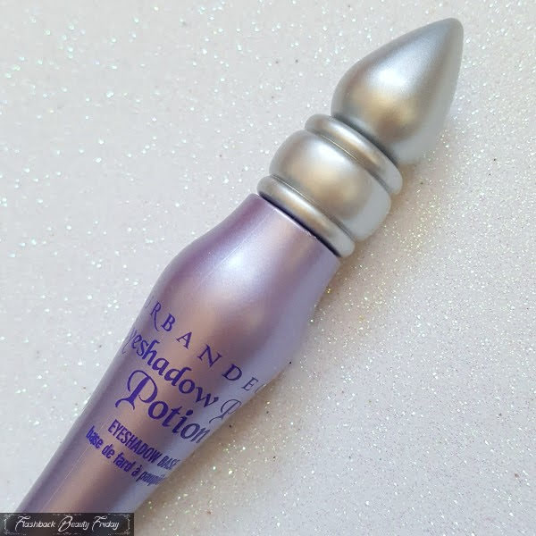 close up of pearlised lilac bottle of Urban Decay Eyeshadow Primer Potion and silver lid