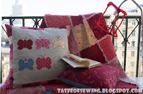 pink and raspberry rag quilt and pillows