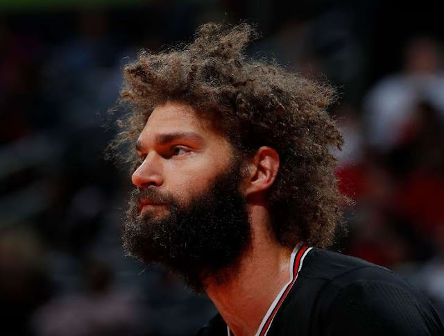 Bulls center Robin Lopez brought his good dog Muppet to his final interview of the season