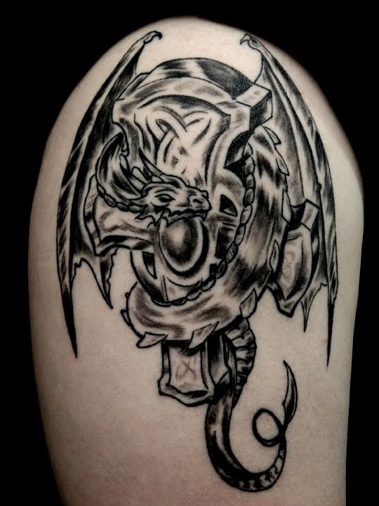 line dragon tattoo, back upper tattoo design. Cross Dragon Tattoo Pictures
