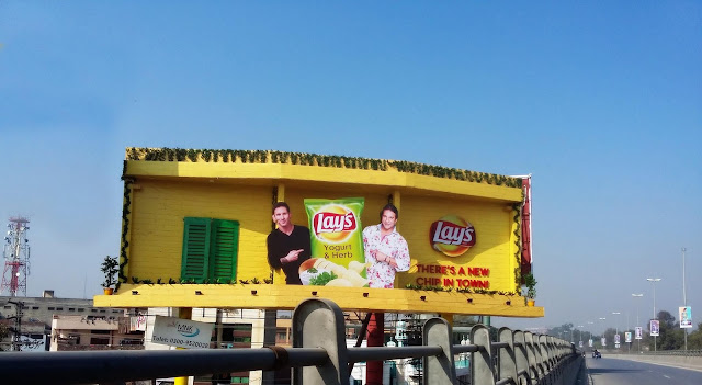 News Lays Chip in Town Messi & Akram Outdoor Campaign - Core Media 