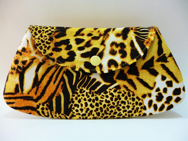 Clutch e Carteira Animal print