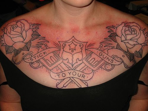 Guns and roses chest tattoo idea for women.