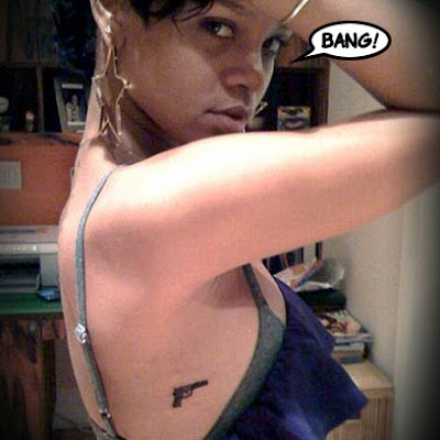 Rihanna Shows Off Her New Gun Tattoo photo credit