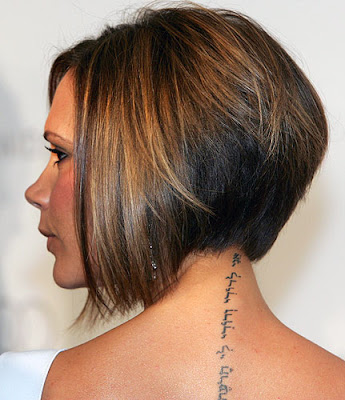 Her new short do uncovered a tattoo running down the back of her neck,