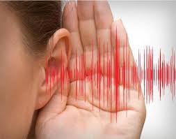 A person listens to sounds with his ear