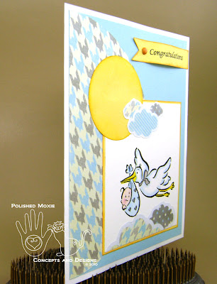 Picture of the front of the baby card set at an angle to the right to show dimension of the elements on it.