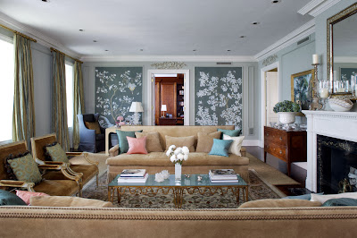 a traditional living room space with lovely flower backdrop