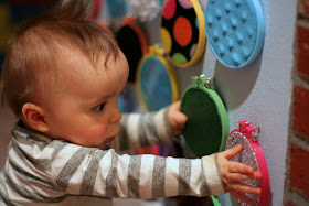 Three different DIY sensory boards along with ideas for how to include older siblings from Fun at Home with Kids