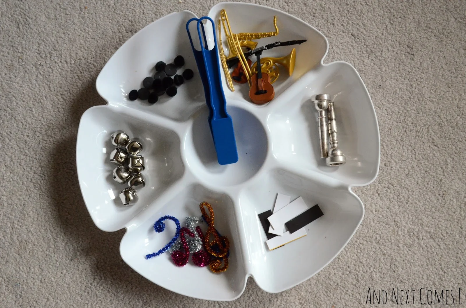 Simple toddler science: music themed invitation to explore magnets from And Next Comes L