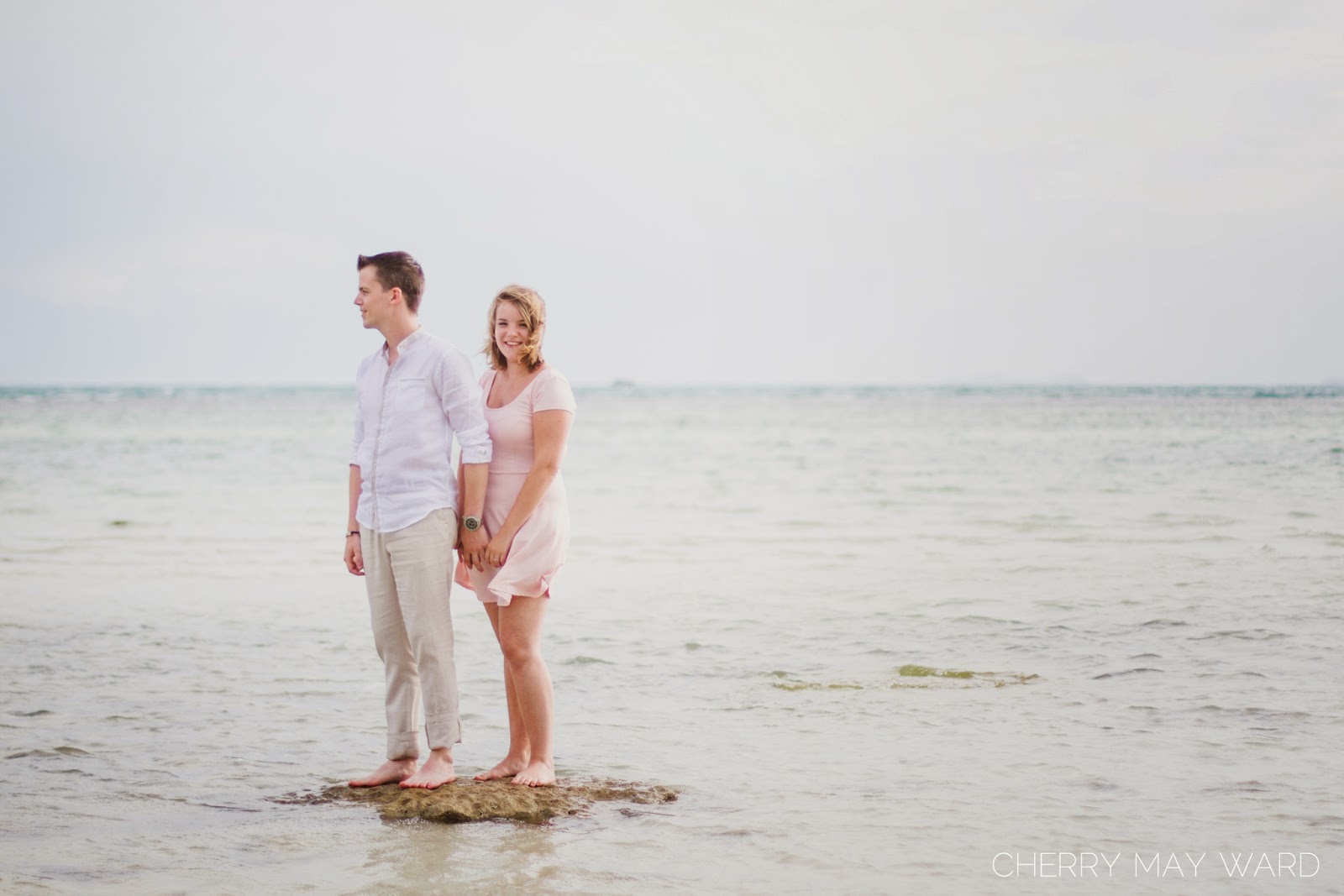 beautiful woman standing on a rock smiling, happy couple, Koh Samui engagement photos