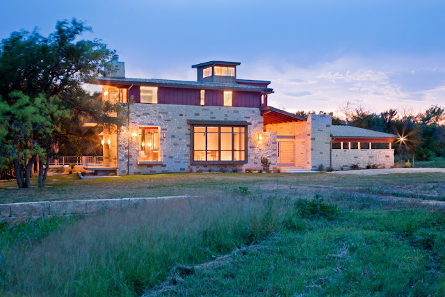 Picture of the contemporary house as seen at sunset from the back