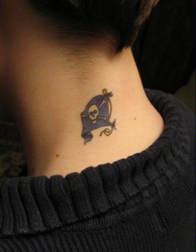 Small pirate flag tattoo on back of neck.