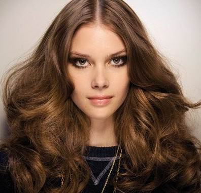 This wavy, permed looking curly style has to be vintage inspired harking