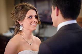 Katie looking at Christian during their wedding ceremony officiated by Patricia Stimac, Seattle Wedding Officiant