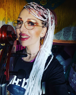 portrait of iServalan at Tale Teller Club with her cello