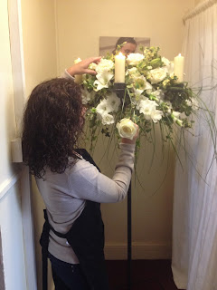 Girl making a wedding flower arrangement 