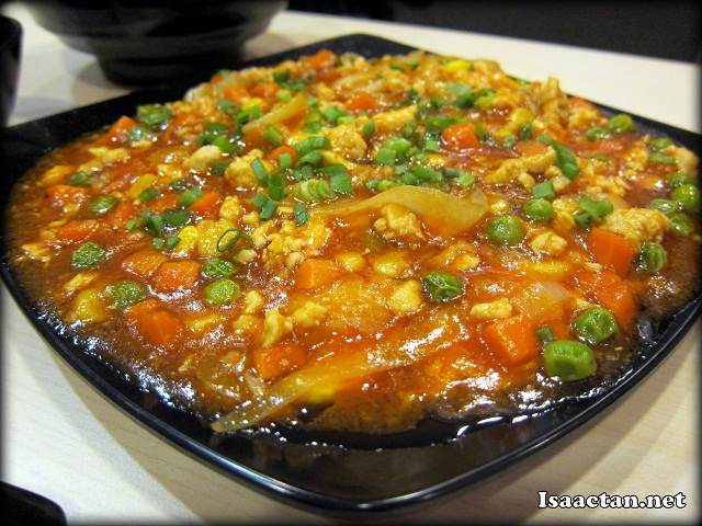 A huge plate of Egg Omelette with szechuan styled sauce