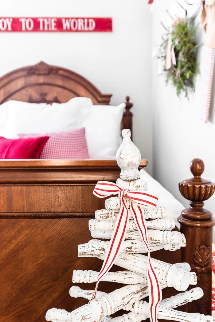 chippy spindle tree in red and white vintage Christmas bedroom