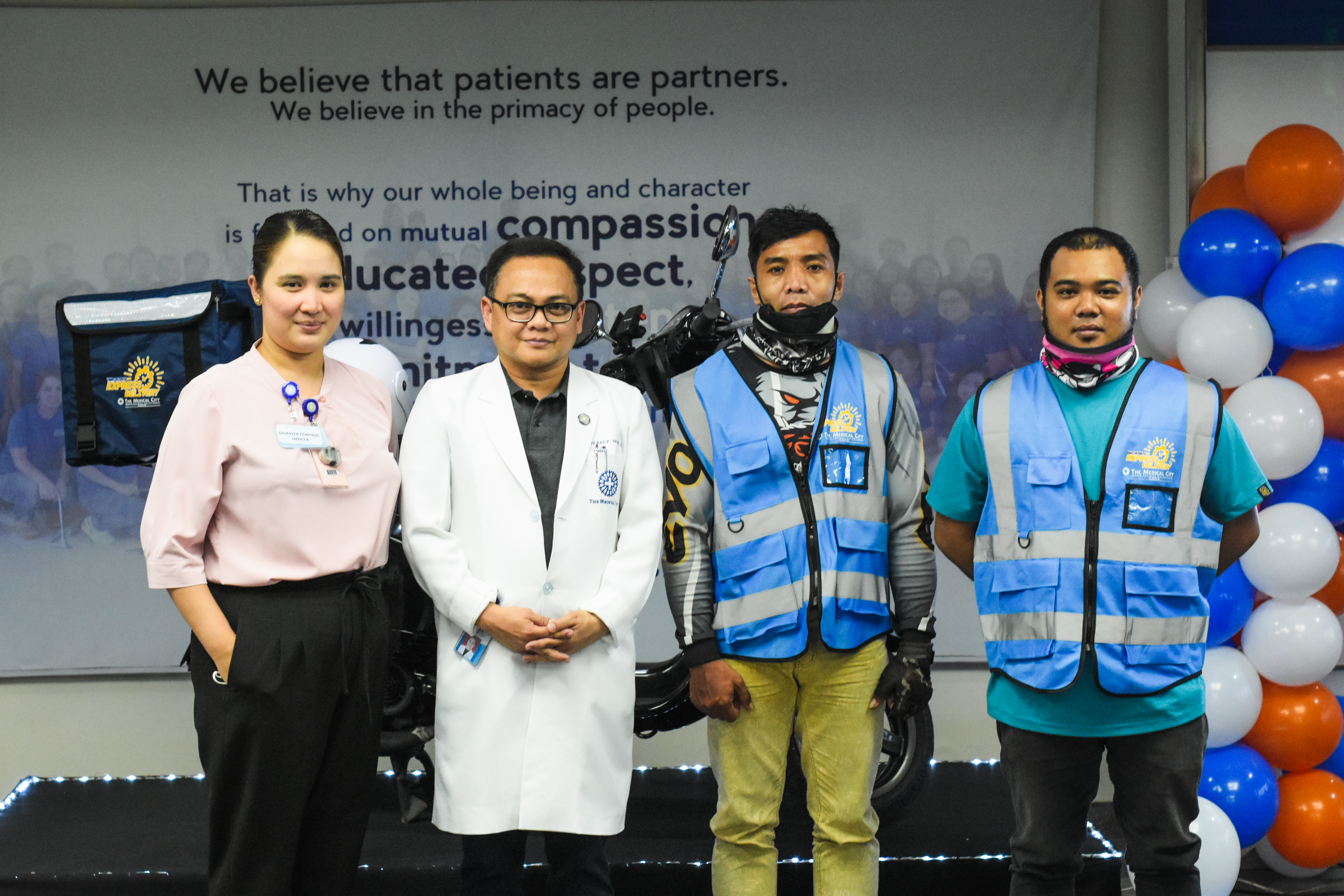 TMC Iloilo Director of Nursing Aliver Vagilidad and TMC Iloilo CEO Dr. Felix Ray Villa together with TMC Iloilo Express Delivery drivers.