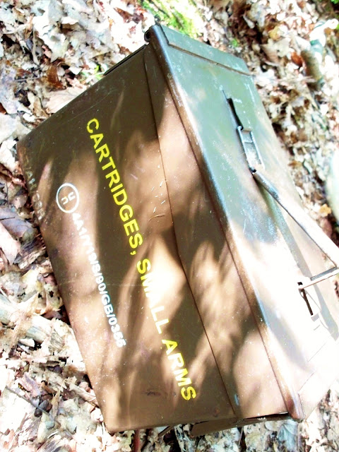 A geocache in an amo box