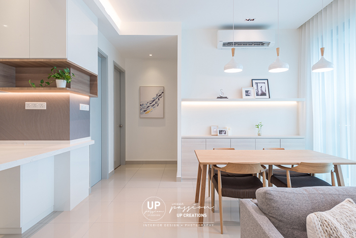 The vyne condo in scandinavian style with combination of white color and wood texture, wood dining table with three white pendant lights and wall shelf display