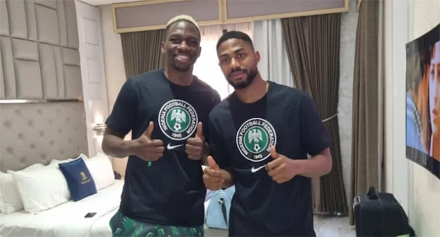 Super Eagles players Kenneth Omeruo and Emmanuel Dennis pose for a picture as Ademola Lookman arrive in camp ahead of Ghana match